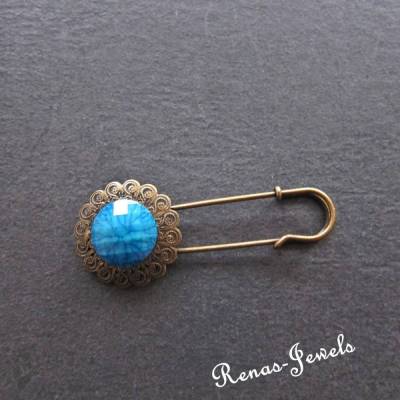 Blaue Ansteckbrosche bronzefarben mit facettiertem Schmuckstein – Eyecatcher für Jacken & Tücher