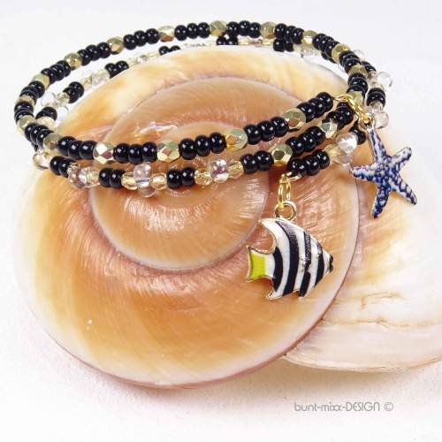 Wickelarmband memory wire, Glasperlen schwarz glasklar Farfalle goldfarb facettiert, 2 Anhänger Fisch Seestern