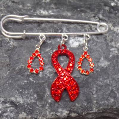 Anstecknadel mit roter Glitzer-Schleife Charity Accessoire