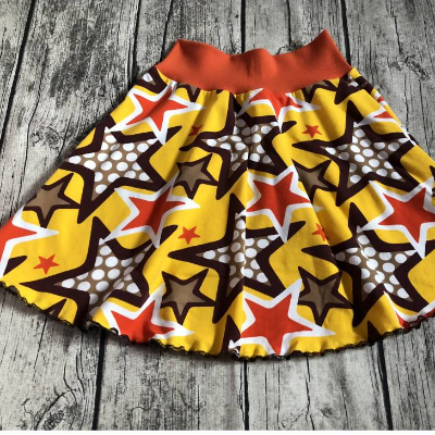 wunderschöner Rock / Drehrock gr.122/128 Sterne Retro braun gelb orange