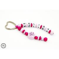 Taschenbaumler/Schlüsselanhänger mit Wunschname - Schutzengel in pink/rosa Bild 1