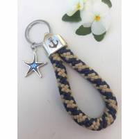 Schlüsselanhänger maritim aus Segelseil, Endstück mit Anker, dunkelblau/beige, mit emaillierten und versilberten Seestern Bild 1