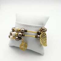 Spiralförmiger Perlen - Armreifen in creme, gold, taupe, ca. 6,5cm Durchmesser, passt sich an. Bild 3