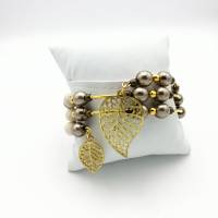 Spiralförmiger Perlen - Armreifen in creme, gold, taupe, ca. 6,5cm Durchmesser, passt sich an. Bild 5