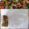 Spiralarmreif mit Glasperlen Farbenspiel in Orange und Grün Bild 10
