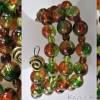 Spiralarmreif mit Glasperlen Farbenspiel in Orange und Grün Bild 6