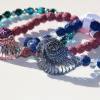 Elastisches Armband mit gestrickter Nautilusschnecke und Lavaperlen/Glasschliff Perlen Bild 8
