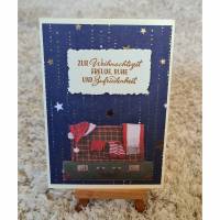Weihnachtskarte mit Sternen , Koffer mit Weihnachtsmütze Bild 1
