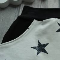 Kinderrock aus French Terry mit Sternen wollweiß schwarz Größe 110 Bild 2