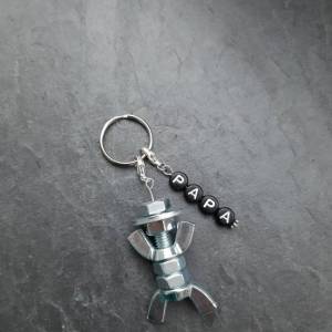 Personalisierter Schlüsselanhänger mit Schraubenmännchen galv. verzinkt - schwarz - 1 Zeile - Papa - Opa - Vatertag Bild 1