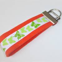 1 Schlüsselband aus Wollfilz mit Ripsband grüne Schmetterlinge, orange Bild 1