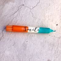orange/türkise Kerze Dip Dye mit Schriftzug Smile Bild 3