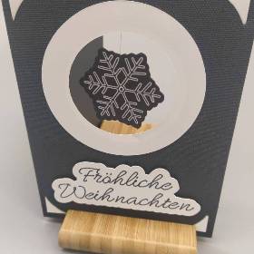 Eine Schneeflocke im Wind - eine Karte mit Drehelement