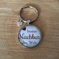 Schicker  Cabochon-Schlüsselanhänger „Bester Nachbar der Welt“ Bild 1