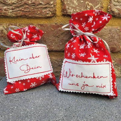Weihnachtliches 2 tgl. Geschenkbeutel-Set aus rotem Baumwollstoff