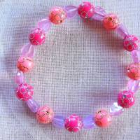 Perlenarmband in Rosa & Pink mit lila Herzchen-Motivperlen handgefertigt von Hobbyhaus Bild 1