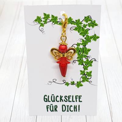 Glücksbringer Schmetterlingselfe goldfarben/rot – Zauberhafter Anhänger mit Schmuckkärtchen