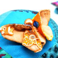 Schmetterling aus Stoff, orange/türkis mit Perle Bild 1