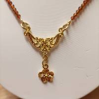 Dirndlkette / Trachtenkette Granatkette aus facettiertem, afrikanischem Granat-Perlen-Strang mit goldfarbigem Mittelteil Bild 5