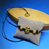 schichtes Schmuckset Blüte, gold schwarz, Halskette und Armband, mit Schiebeknoten, Metallperlen, Schmuck Bild 1