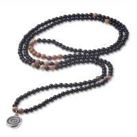 Handgefertigte Halskette aus Onyx- und Olivenholzperlen, mit Silber. Bild 1