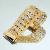Funkelnde Kristalle in Schwarz und Gold - Damen-Armband Bild 1