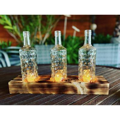 Tischleuchter dreiflammig mit alten Three Sixty Vodka Flaschen - Glas auf Holz - besonderes Unikat auf Kantholz